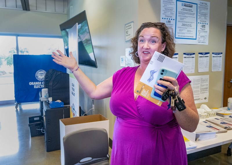 Irvine, CA - March 02: With her ballot in hand, Congresswoman and U.S. Senate candidate Katie Porter, right, speaks to the media as she waits for her son, Luke Hoffman, 18, to vote for the first time at the vote center at the University Hills Community Center in Irvine on Saturday, March 2, 2024, in the 2024 California presidential primary election. (Photo by Mark Rightmire/MediaNews Group/Orange County Register via Getty Images)