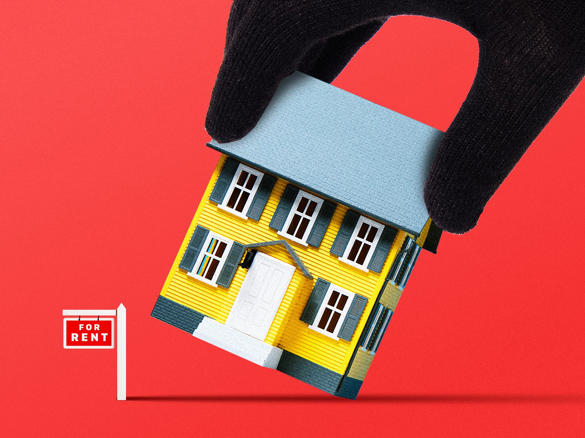 A burglar's hand picking up a house that has a 
