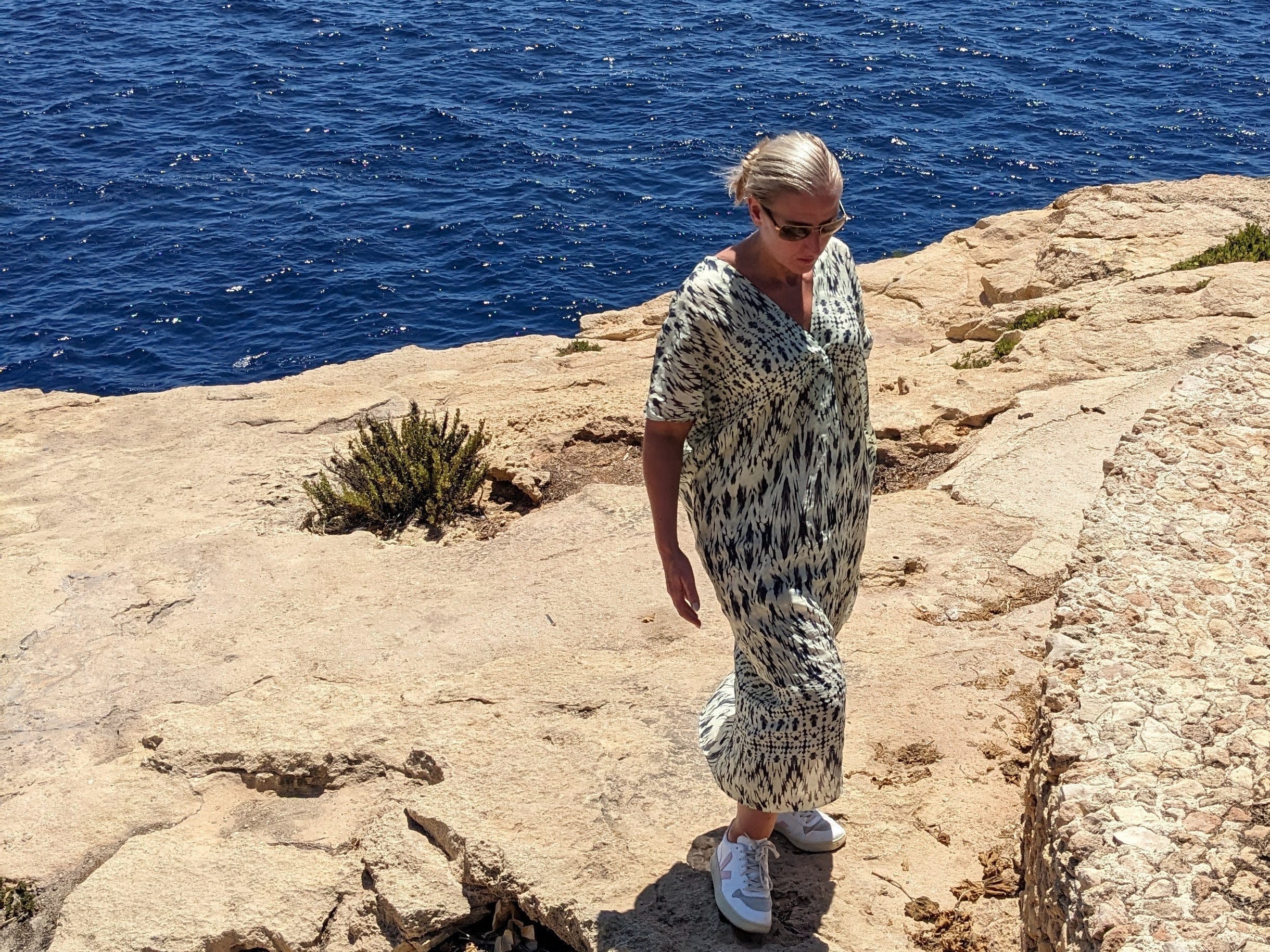 Author Louise Slyth walking on beach