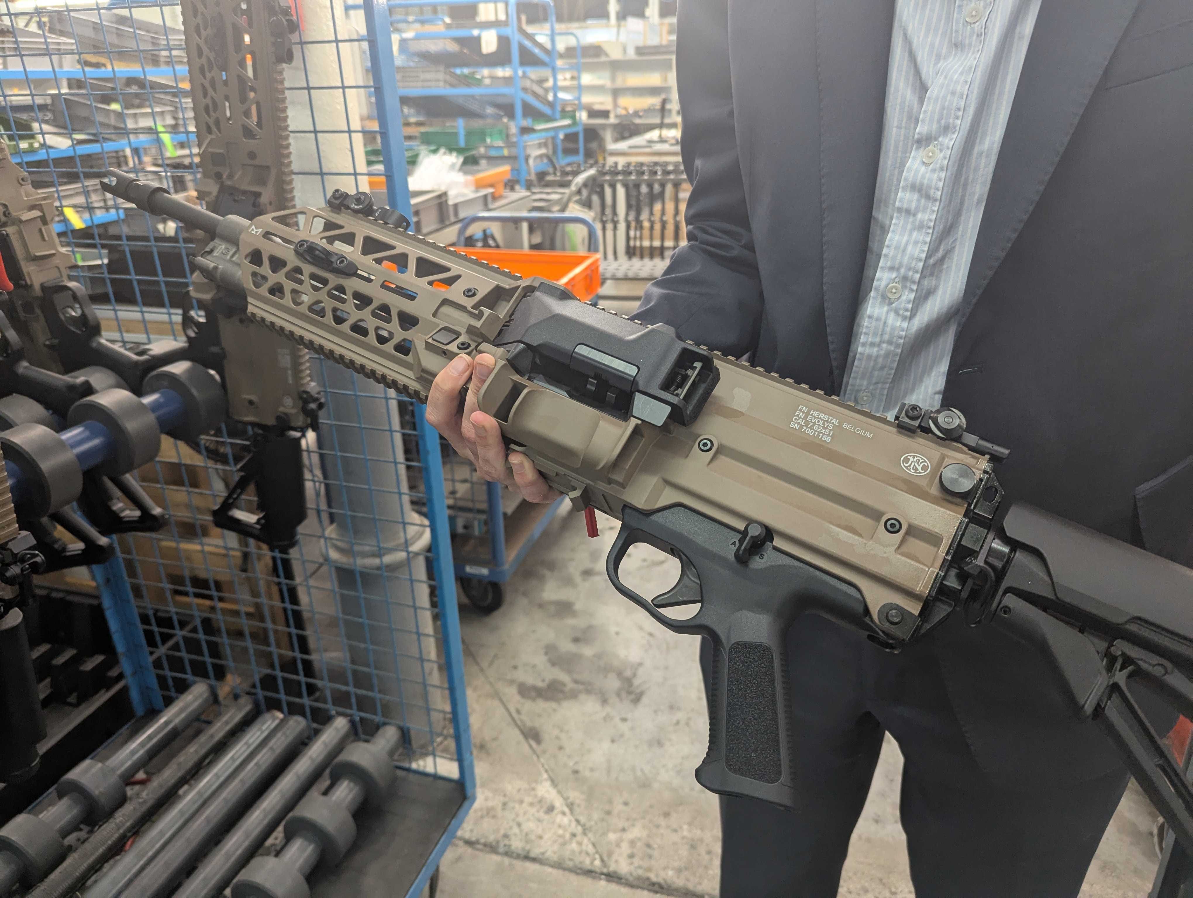 An FN Browning executive holds the FN Evolys.