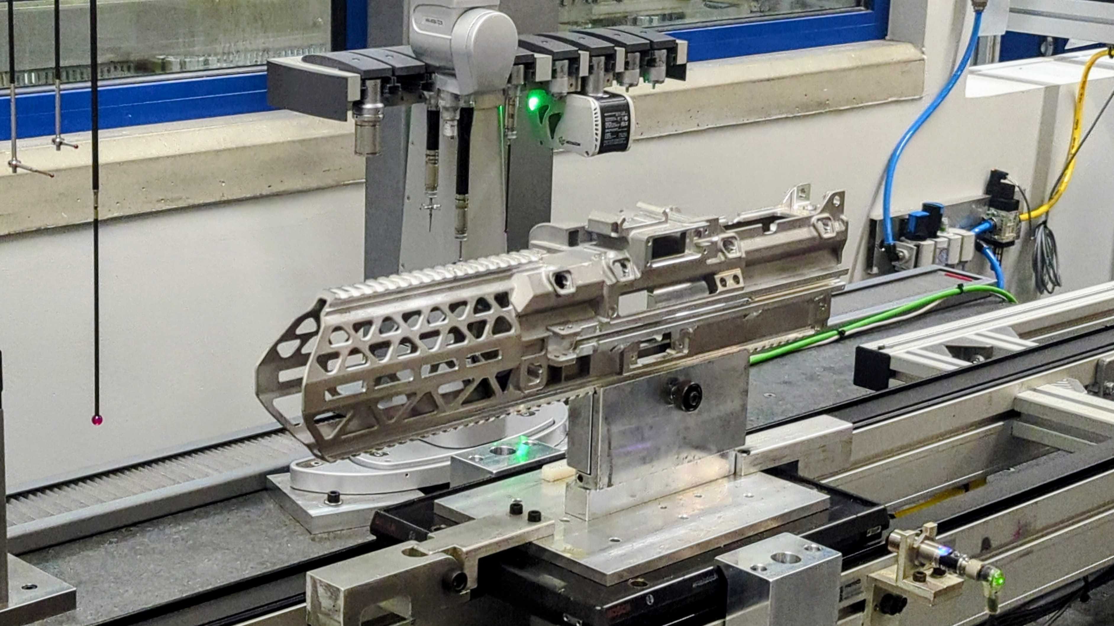 A receiver for the FN Evolys lies on an automated assembly line.