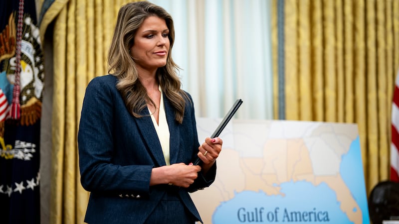 Lindsey Halligan, attorney for U.S. President Donald Trump, holds ceremonial proclamations to be signed by U.S. President Donald Trump