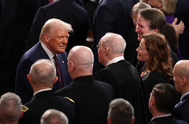 President Donald Trump greets retired Supreme Court Justice Anthony Kennedy as he arrives to deliver an address to a joint session of Congress at the U.S. Capitol on March 04, 2025.