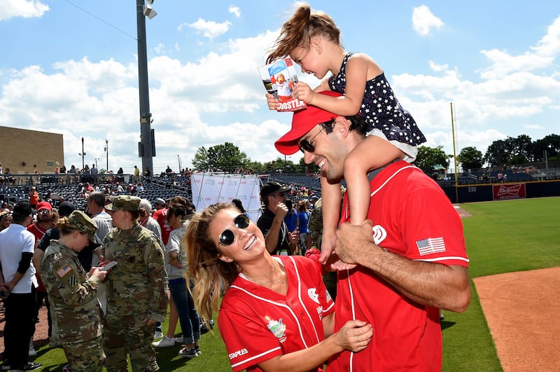 NASHVILLE, TN - JUNE 10: Singer-songwriter Jessie James Decker, NFL player Eric Decker, and their daughter Vivianne Rose Decker attend the 27th Annual City of Hope Celebrity Softball Game at First Tennessee Park on June 10, 2017 in Nashville, Tennessee.  (Photo by Rick Diamond/Getty Images for City Of Hope)