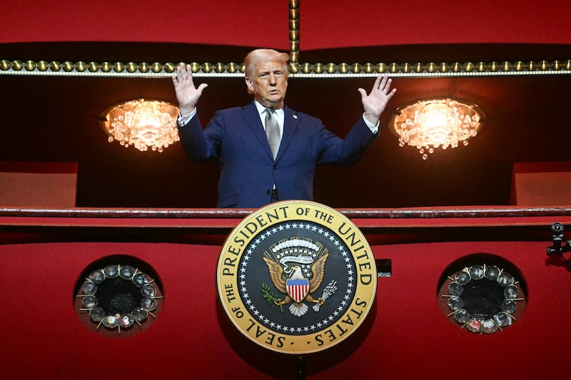 TOPSHOT - US President Donald Trump stands in the presidential box as he tours the John F. Kennedy Center for the Performing Arts in Washington, DC, on March 17, 2025. Trump was appointed chairman of the Kennedy Center on February 12, 2025, as a new board of trustees loyal to the US president brought his aggressive rightwing, anti-