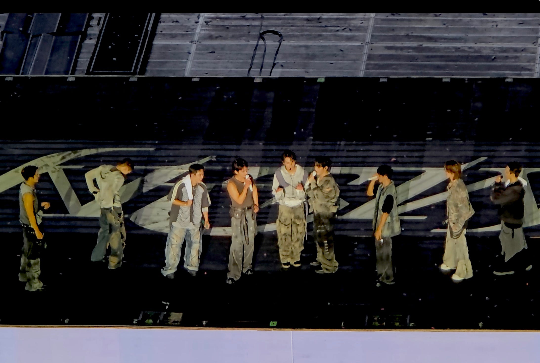A photo of Joshua Hong and the band Seventeen at their Seoul concert.