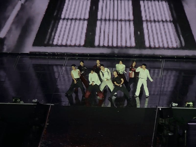 A gif of Joshua Hong and Seventeen performing Rock with You in Incheon.