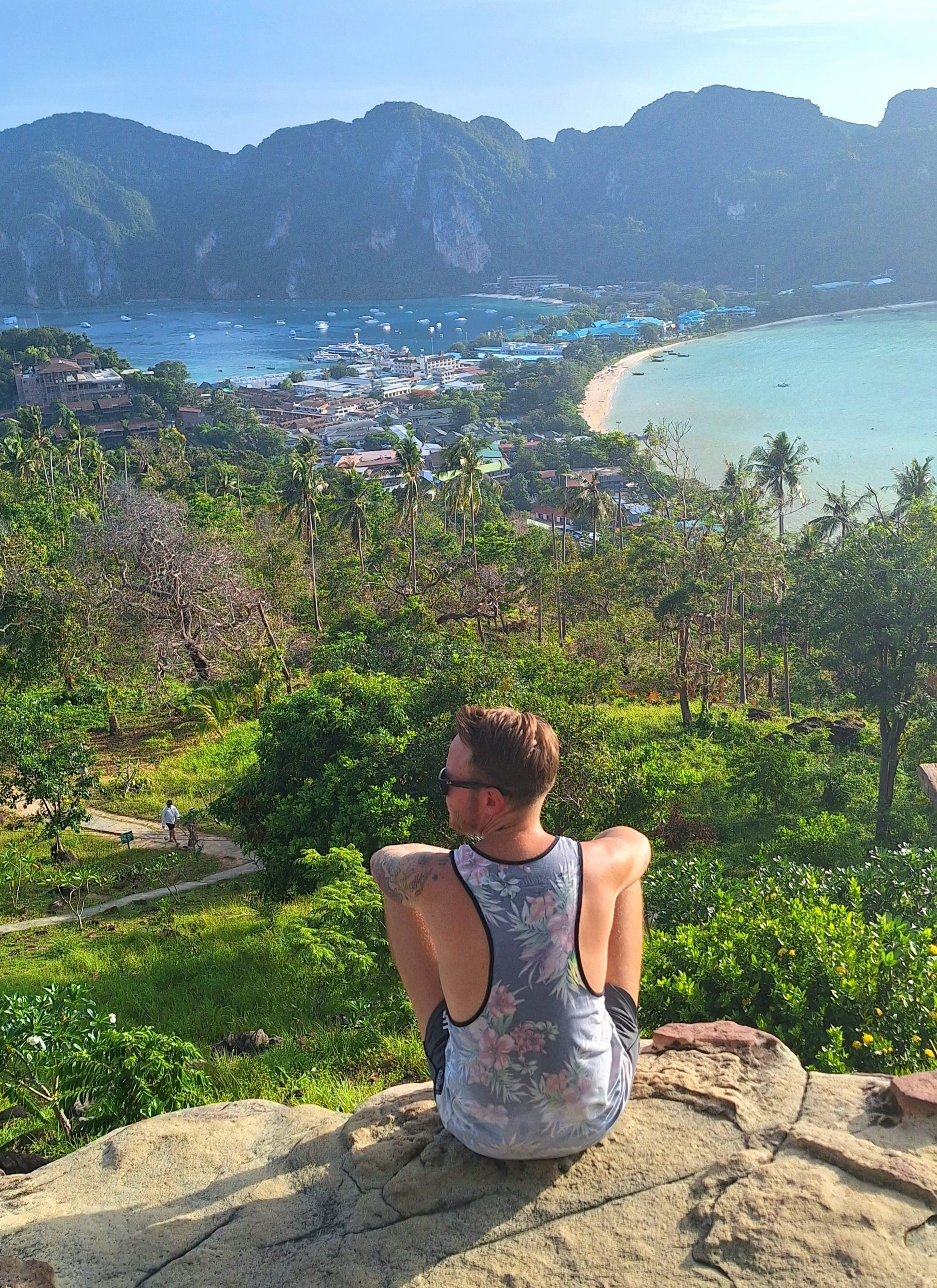 Andre Neveling sitting on a cliff at Koh Phi Phi, Thailand.