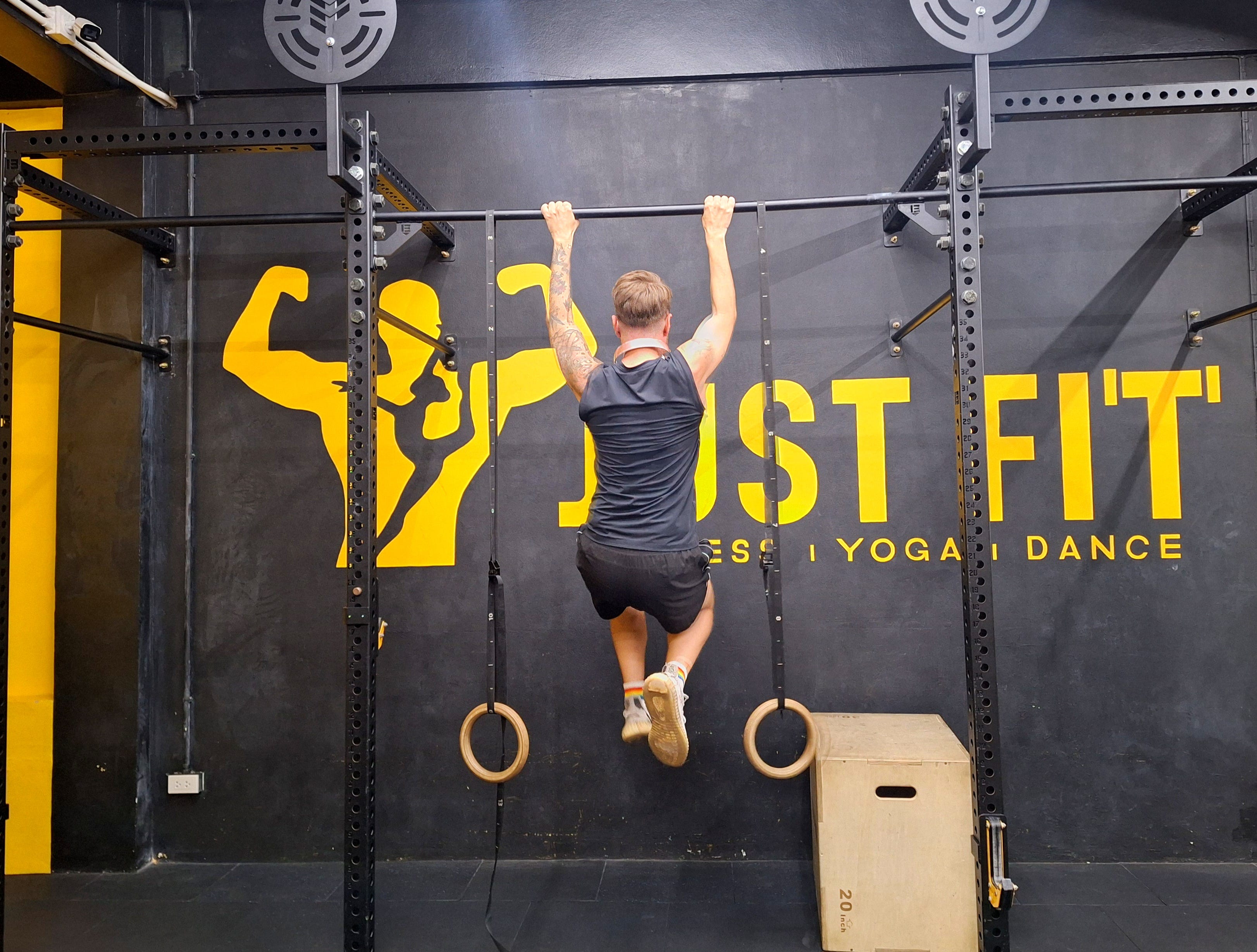 Andre Neveling is doing pull-ups at Just Fit gym in Phuket, Thailand.