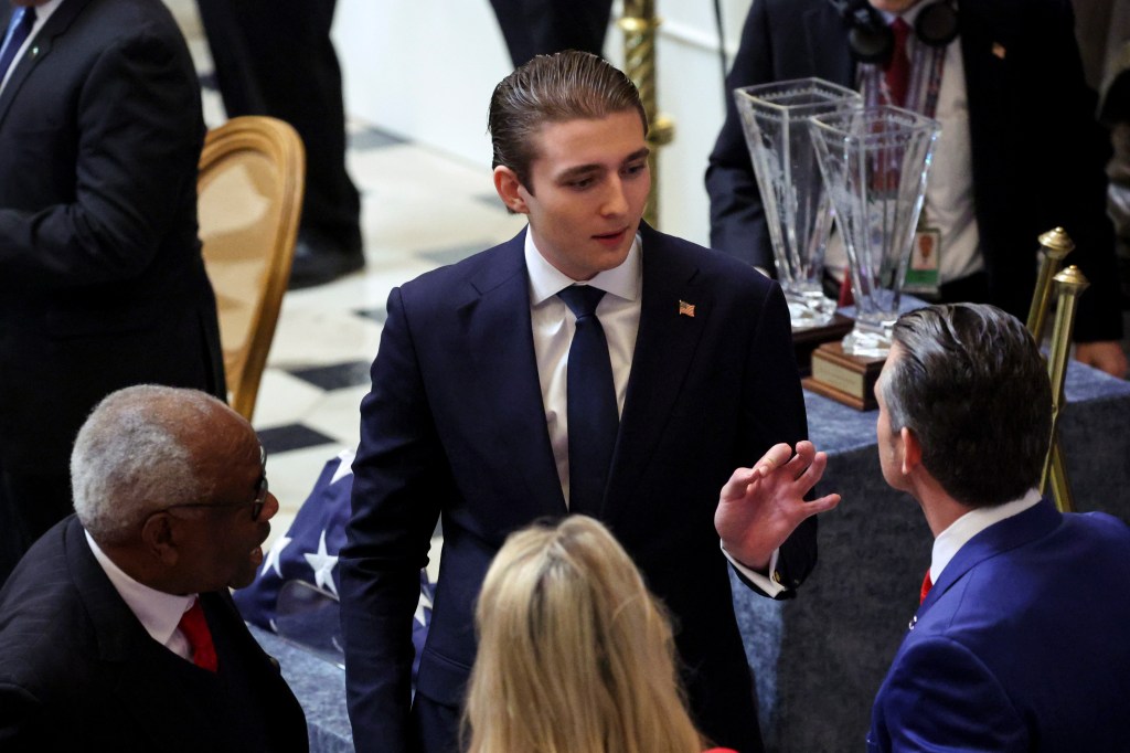 Barron Trump speaking to Pete Hegseth on Capitol Hill.