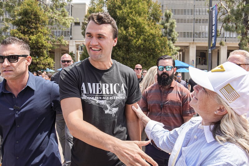 Charlie Kirk, founder of Turning Point USA, enters the plaza and talks with his supporters in San Diego.