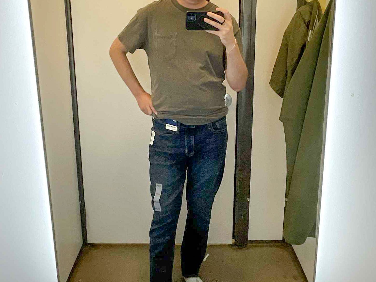 Mike taking a mirror picture in an Old Navy fitting room.