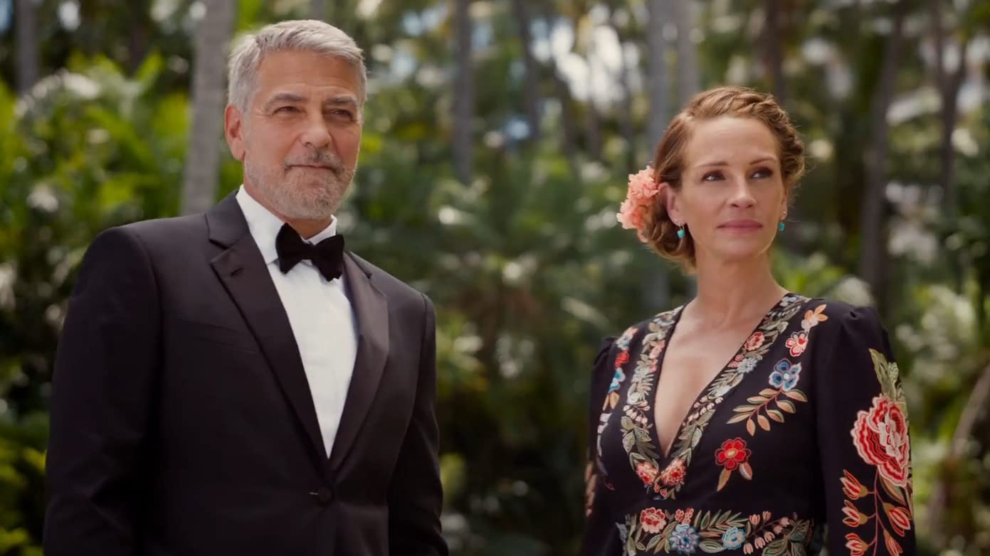 George Clooney in a tuxedo and Julia Roberts in a floral dress