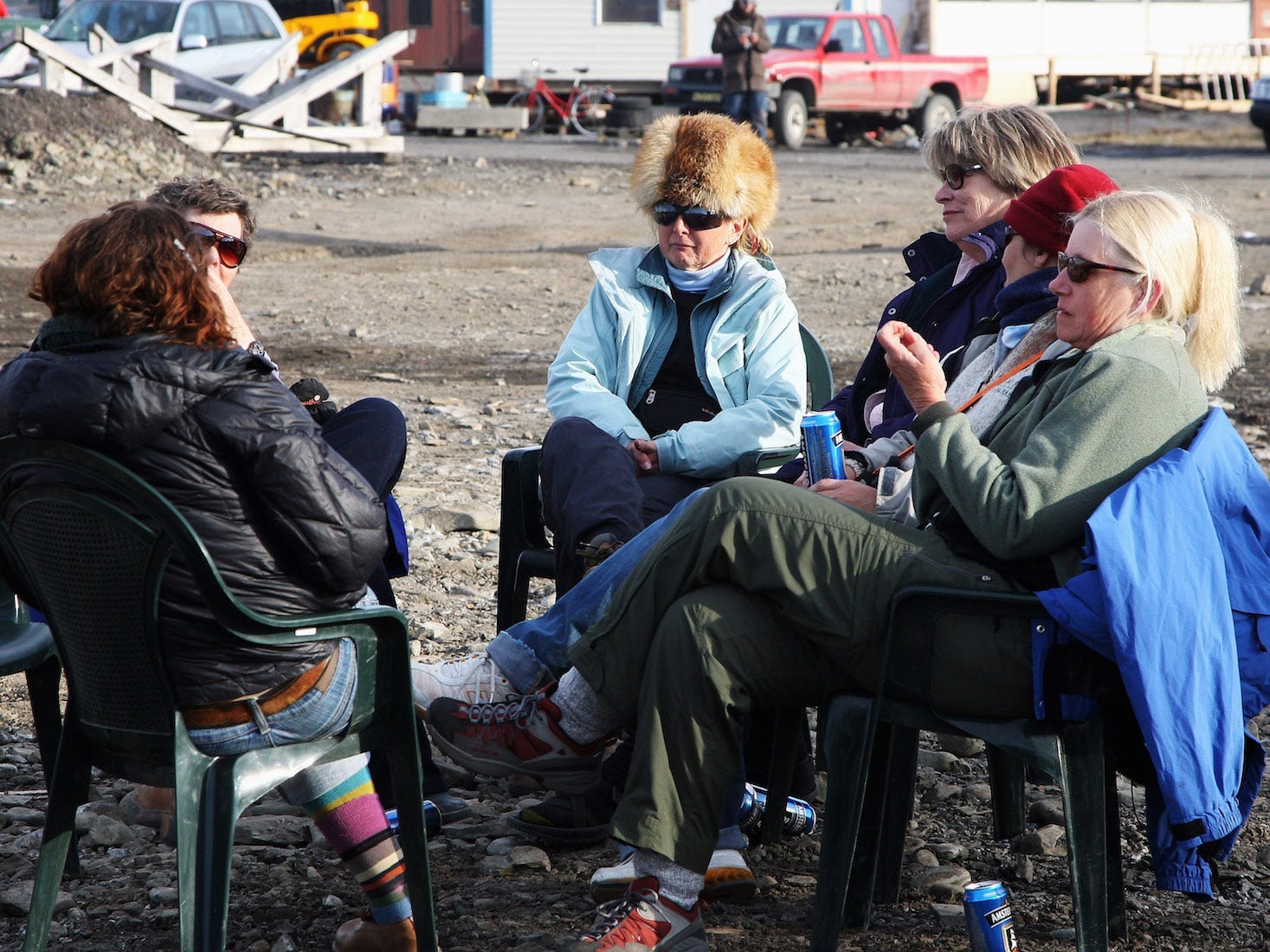 People relax by a bonfire at the sailing club party to celebrate Midsummer on June 21, 2008 in Longyearbyen, Norway. Longyearbyen is the seat of Norwegian local administration in Svalbard, 620 miles south of the North Pole, and was founded in 1906 by the American John Munroe Longyear who started coal mining here, an important part of the local history ever since. Longyearbyen was only opened for general tourism in 1990 and is a haven for eco-tourists who come to see the abundant polar bears, seals and whales. Svalbard consists of a group of islands ranging from 74? to 81? North, and 10? to 35? East, thus making it the northernmost part of Norway.