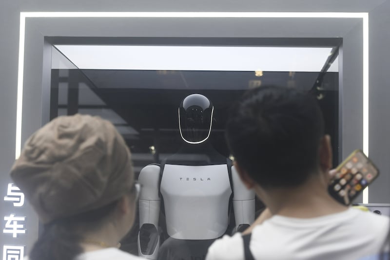 Visitors visit Tesla's humanoid robot