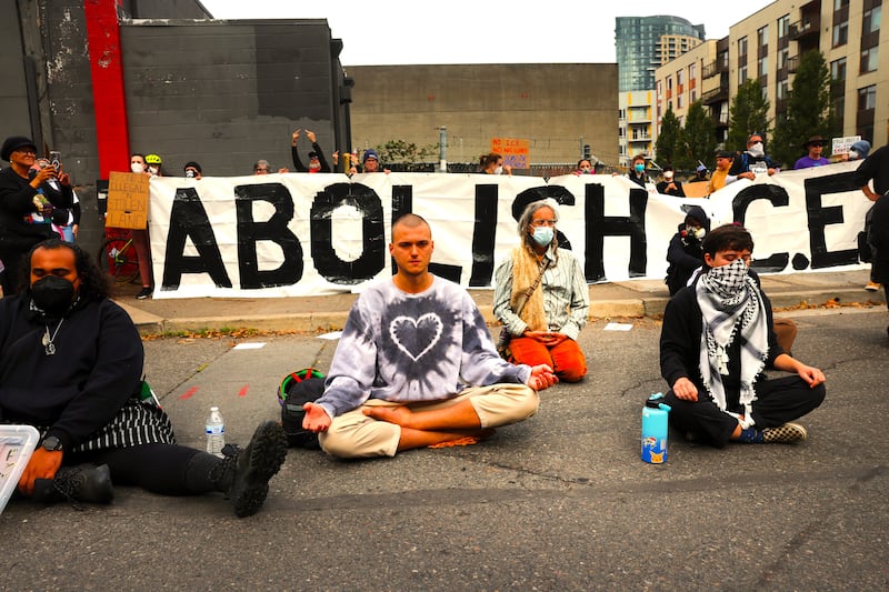 Protesters gather outside of a downtown U.S. Immigration and Customs Enforcement (ICE) facility