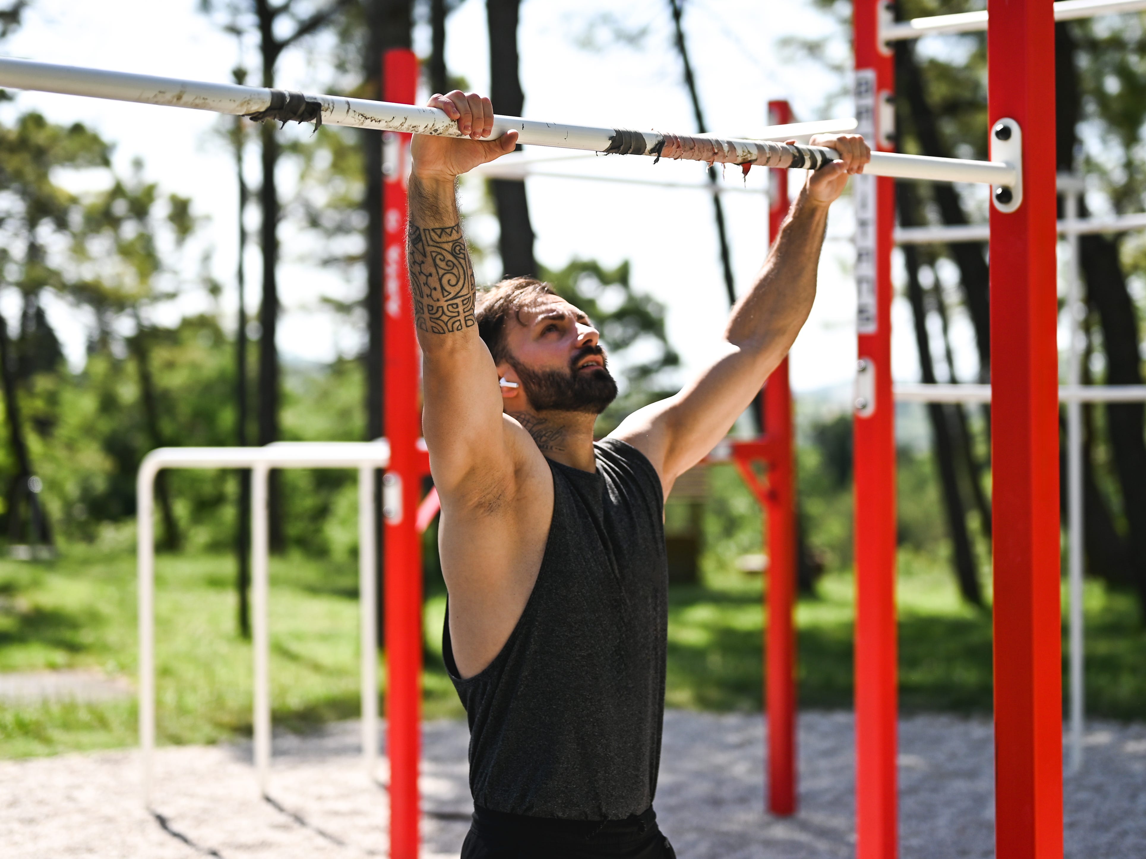 A man doing a dead hang