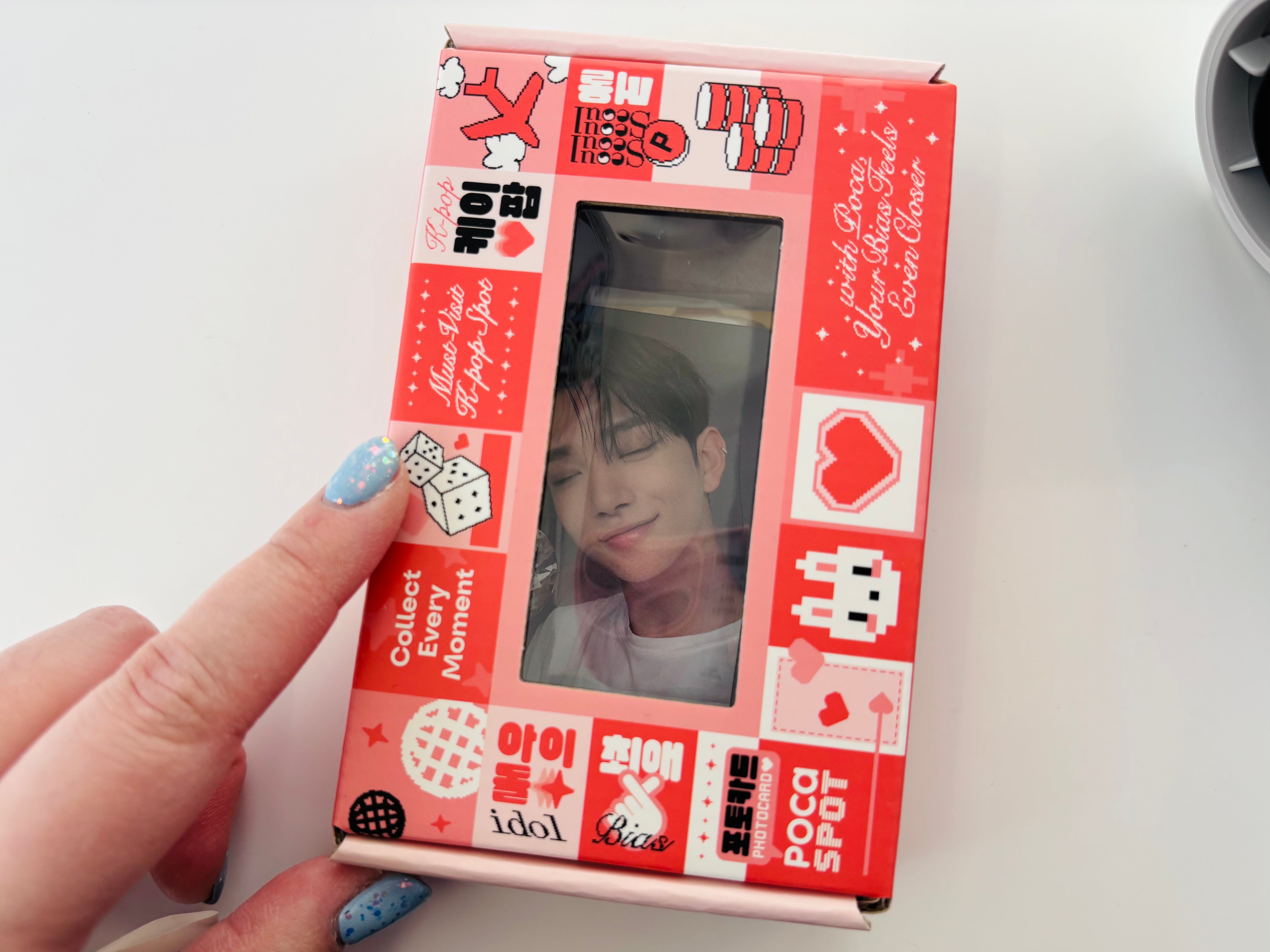 An image of a hand holding a box of products from Pocaspot.