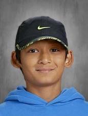 Raghav Shrestha wearing a black Nike cap and blue hoodie.