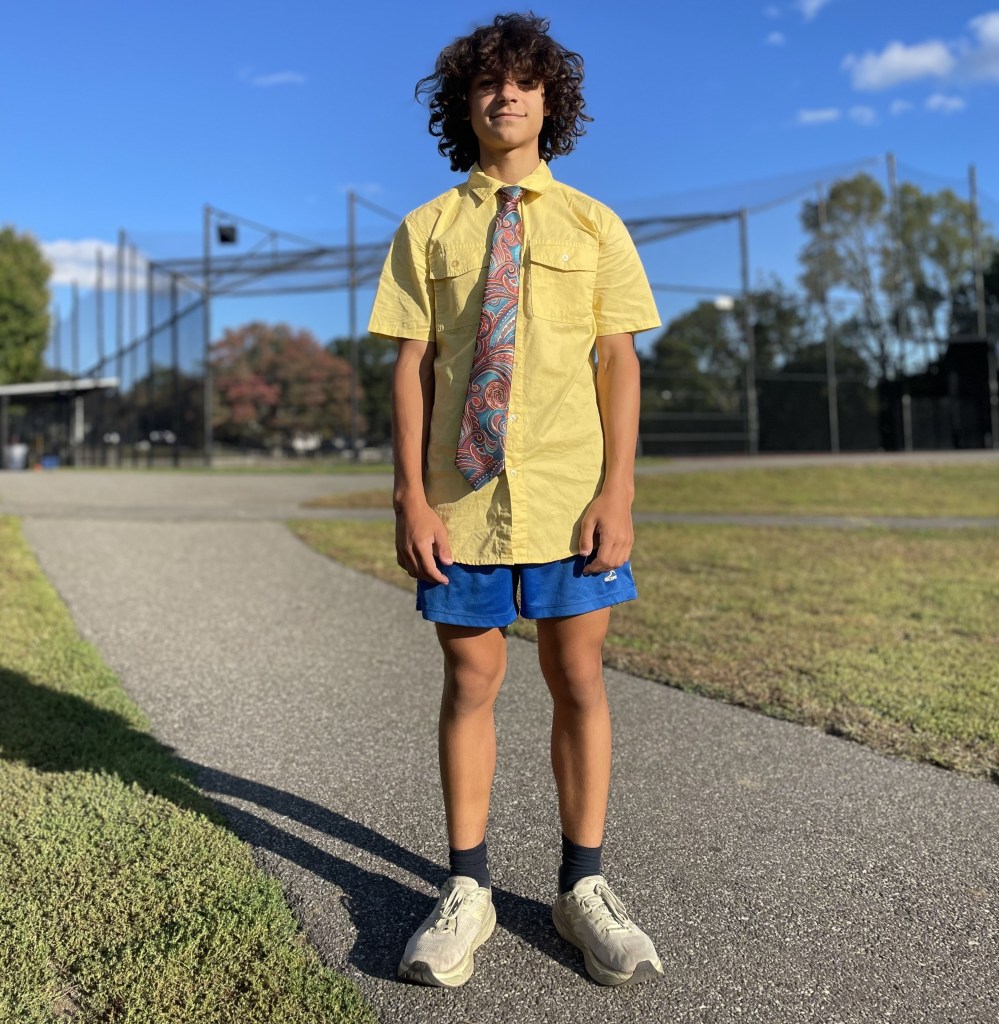 George Kahi, an enthusiastic 14-year-old on Port Washington’s varsity team, who made the New Balance nationals as an eighth grader, is a character on the track who chooses to practice and work out in dress clothes.