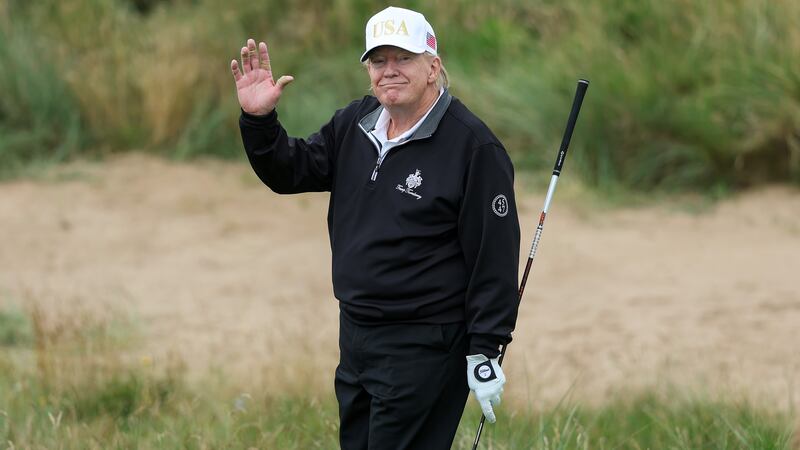 President Donald Trump holds a driver after teeing off during the opening of his new golf course at his Trump International Golf links resort on July 29, 2025 in Balmedie, Scotland. President Trump is visiting Scotland in a trip that’s part-vacation, part-work, as he stayed at his Trump Turnberry golf course, followed by Trump International Golf Links in Aberdeenshire, between July 25 to 29.