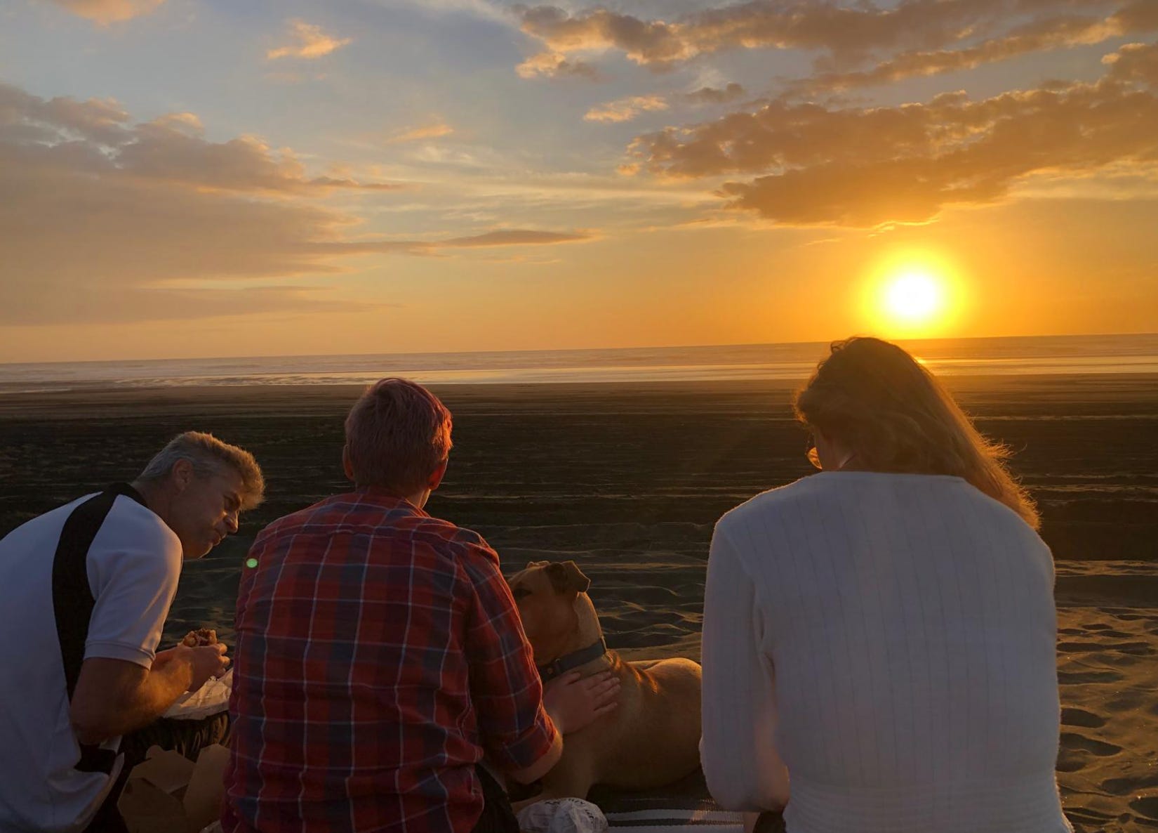 The writer's family on the beach in New Zealand.