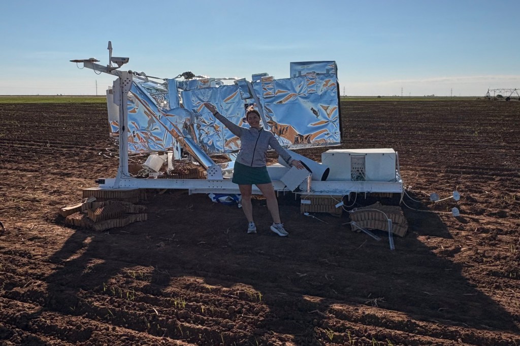 Ann Walter stands infront of the NASA research equipment that fell from the sky near her home in Edmonson, Texas, on Oct. 2, 2025.