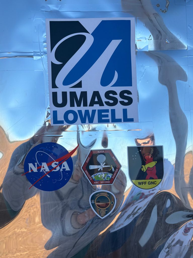 The equipment: a boxy piece of scientific equipment about the size of a sport-utility vehicle, attached to a massive parachute, was adorned with NASA stickers.