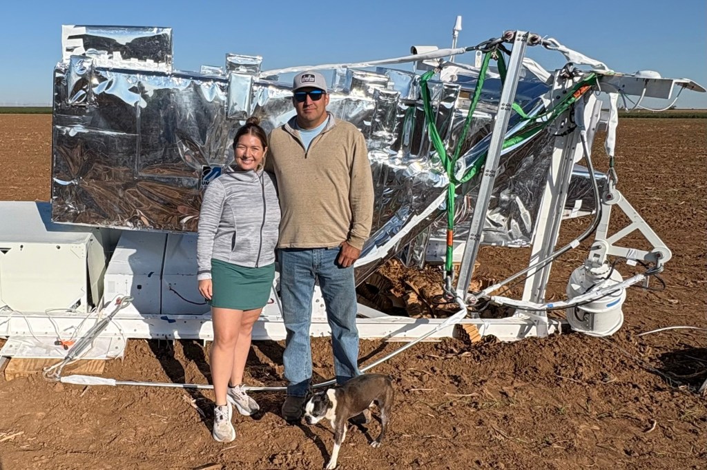 Ann Walter and her husband, Hayden, stand by the NASA equipment on their neighbor's wheat farm.