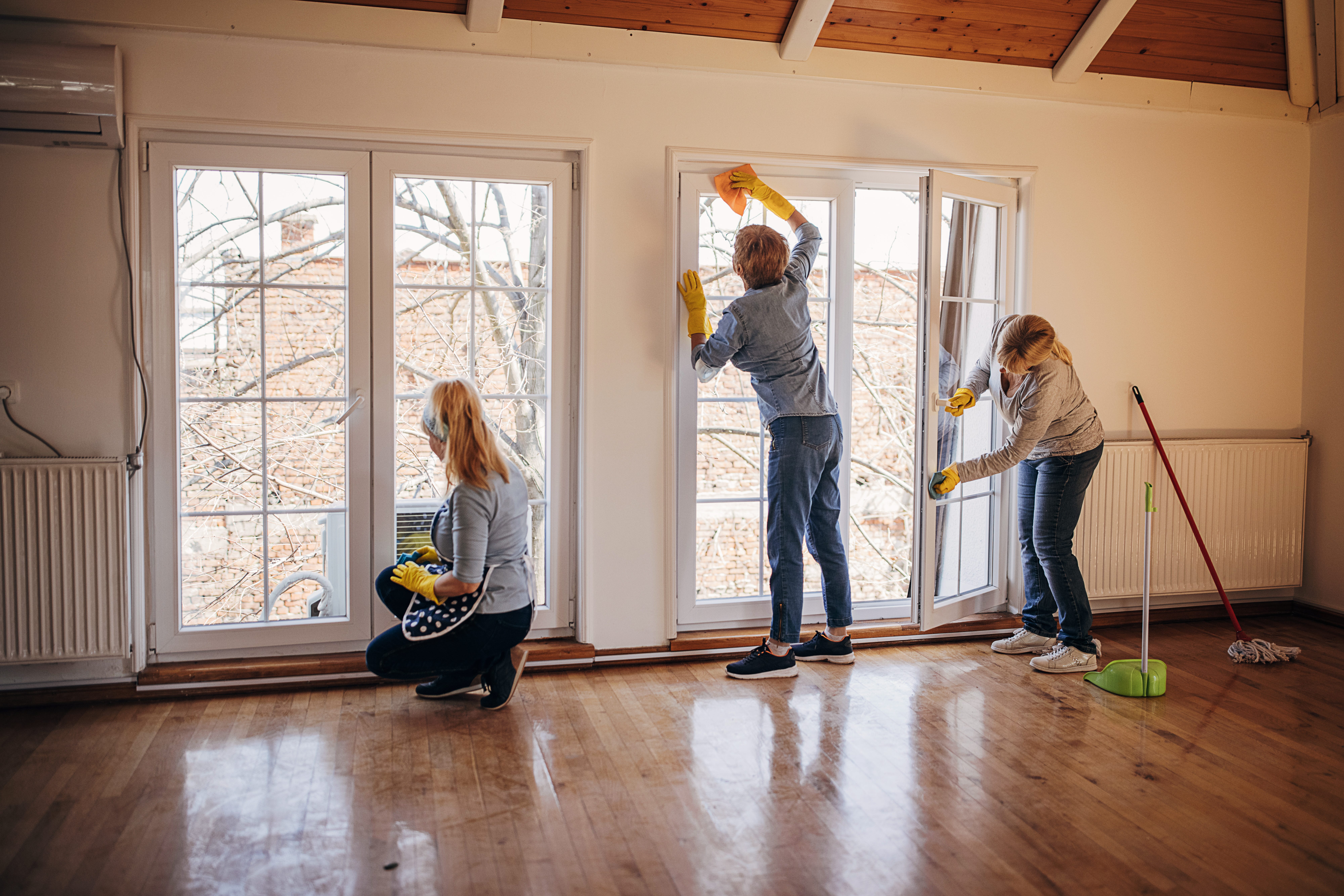 Workers cleaning a home.