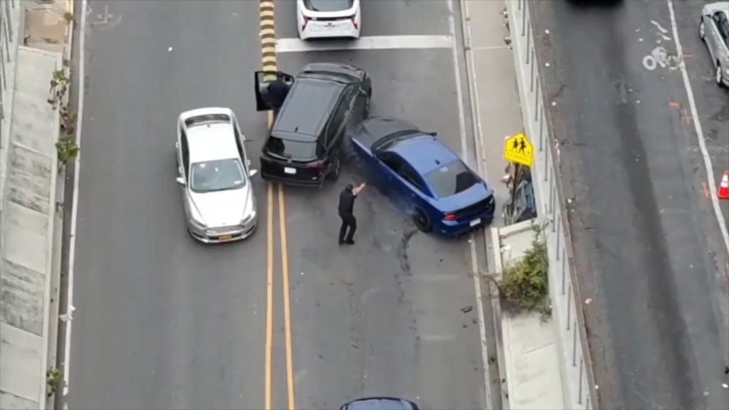 Police apprehending car thieves after a car chase in the South Bronx.