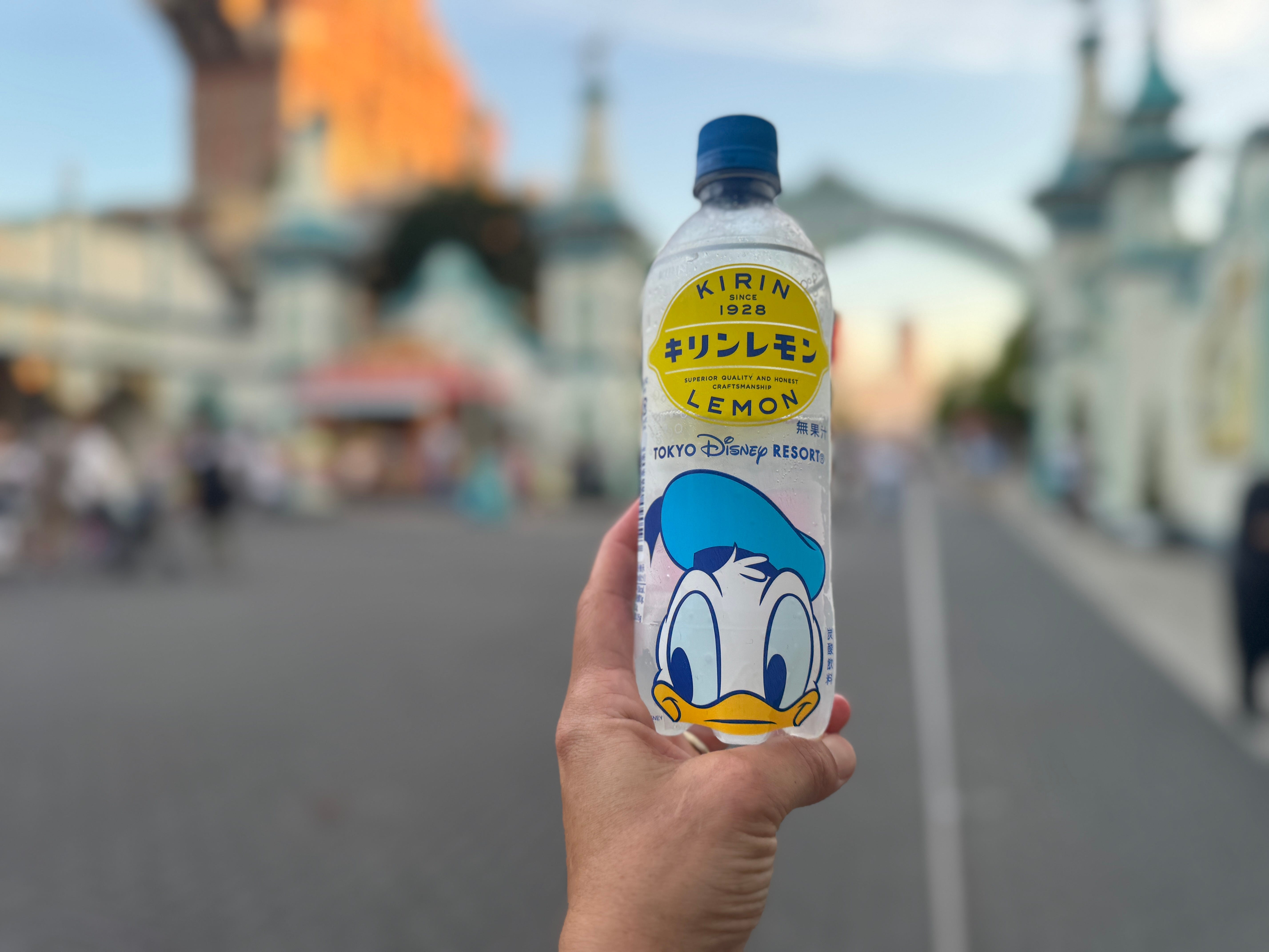 The author holds up a bottle of Kirin Lemon, a drink she enjoyed at Tokyo Disney.