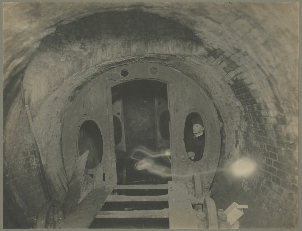 Stanley Yale Beach inside the Beach Pneumatic Railway passenger car after its discovery in 1899.