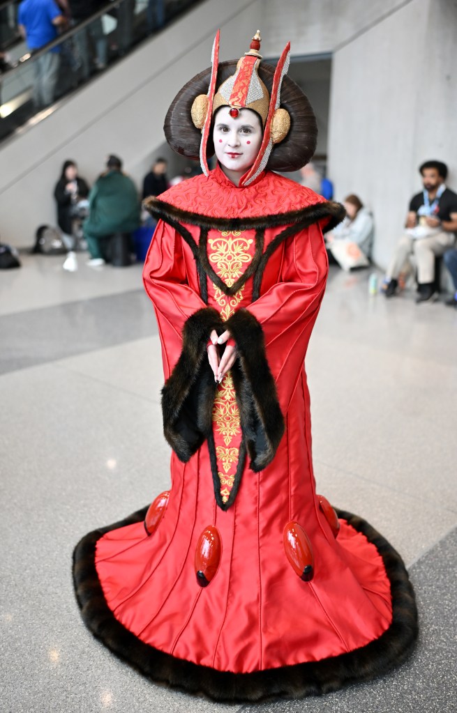 A cosplayer posed as Padme Amidala from Star Wars at New York Comic Con 2025.