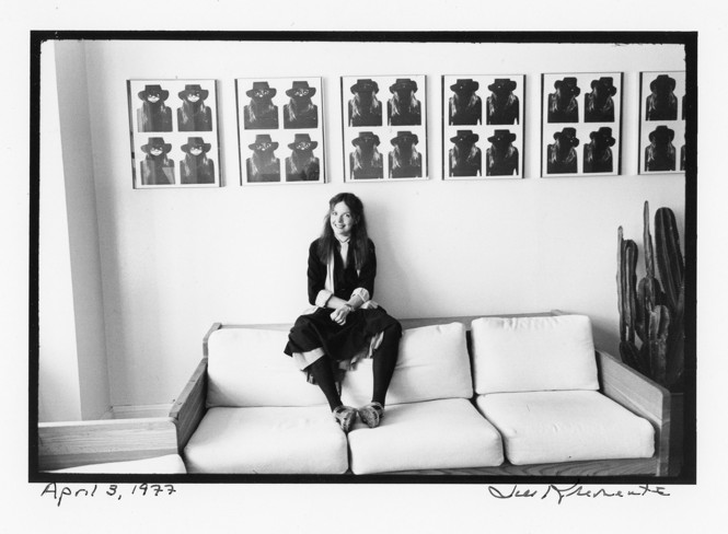 Diane Keaton, in her Manhattan apartment in 1977, sits beneath a series of self-portraits she took in a subway photo booth. (Credit: Jill Krementz)