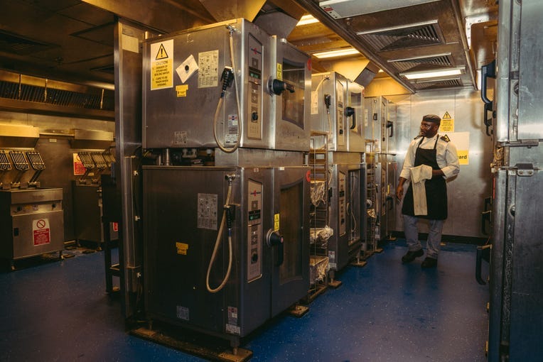 Chefs preparing for lunch service at the ship's kitchen