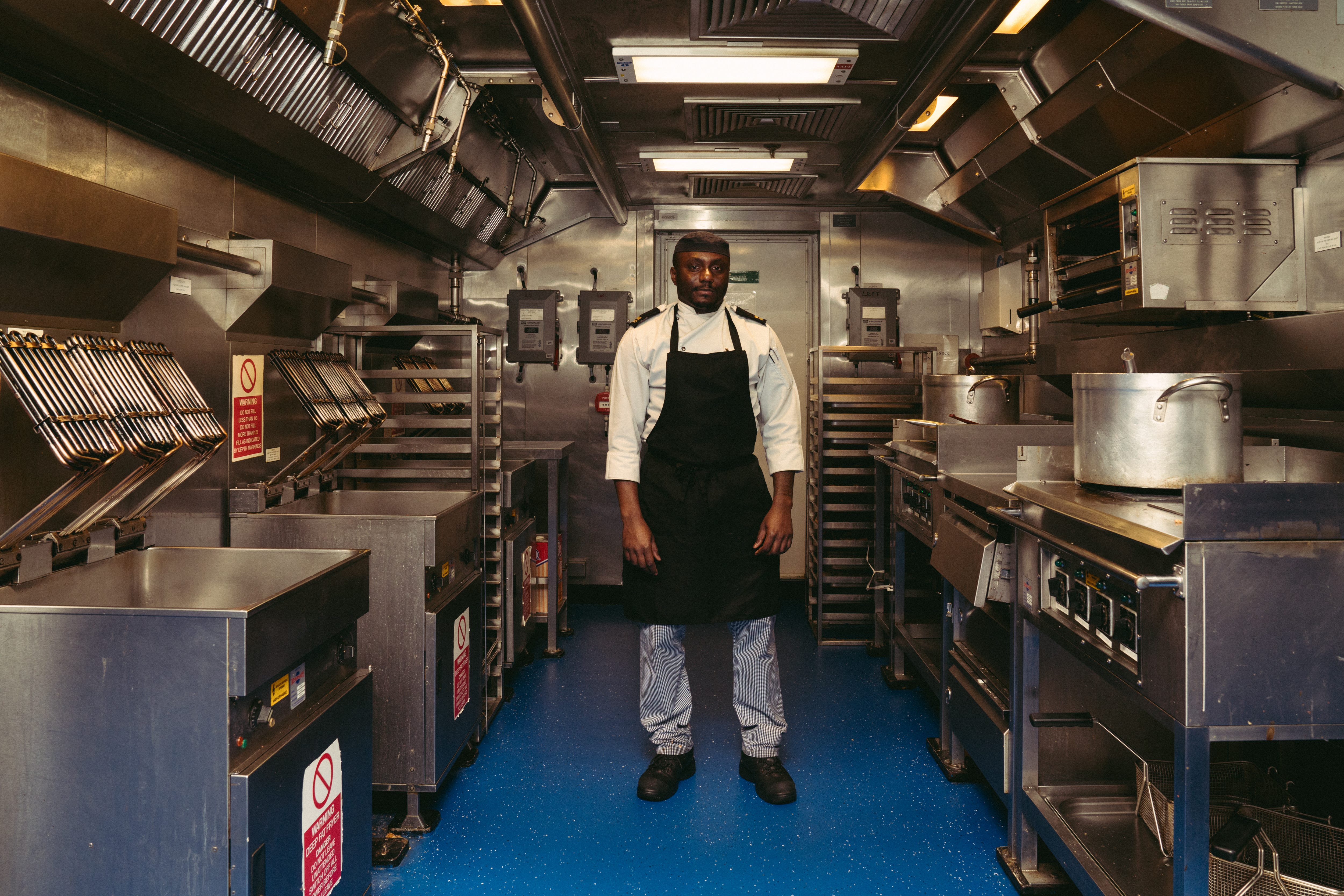 Main chef Ockeem Hibbert overseeing the lunch service at the ship's kitchen ( The Galley).
