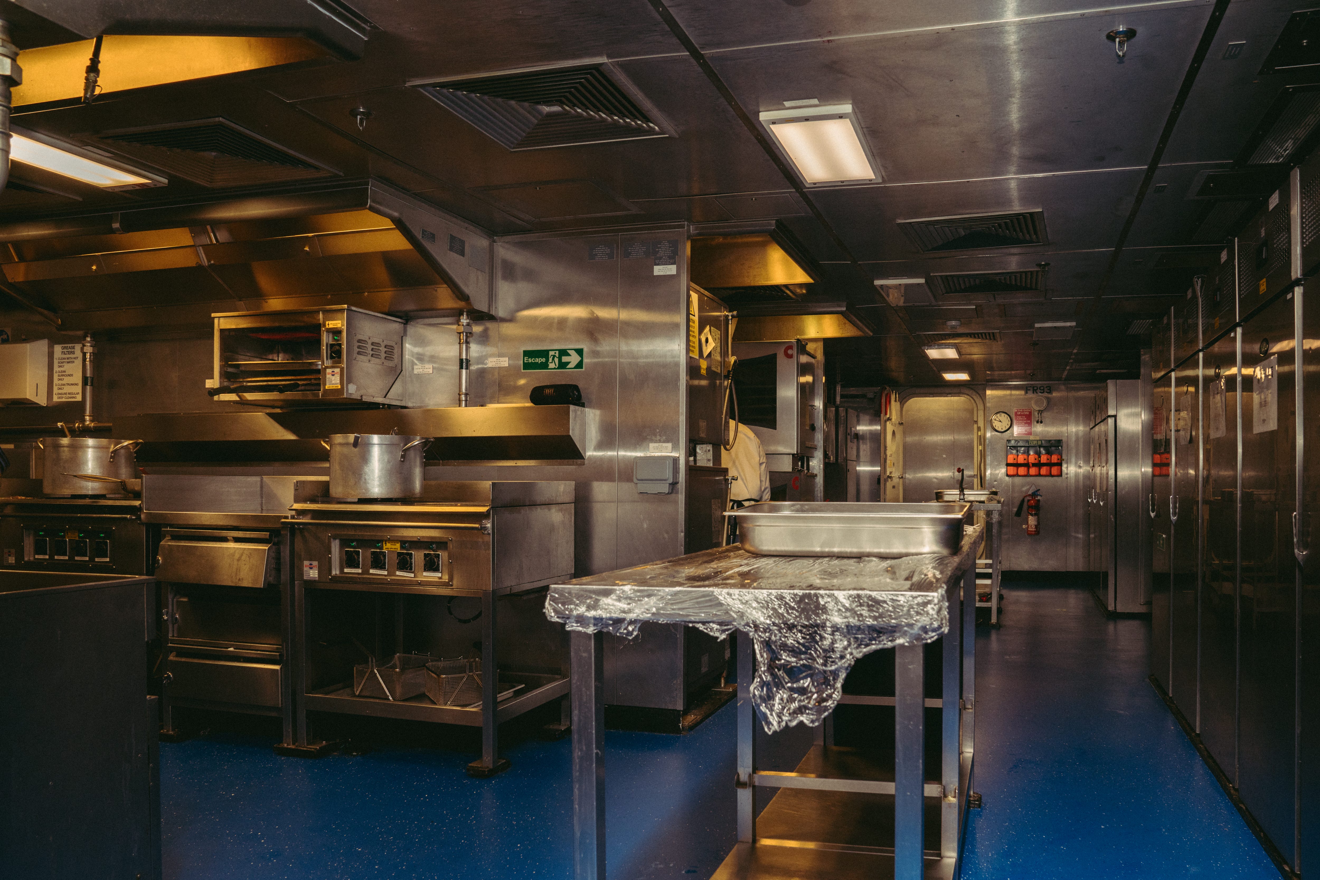 Chefs preparing for lunch service at the ship's kitchen ( The Galley).