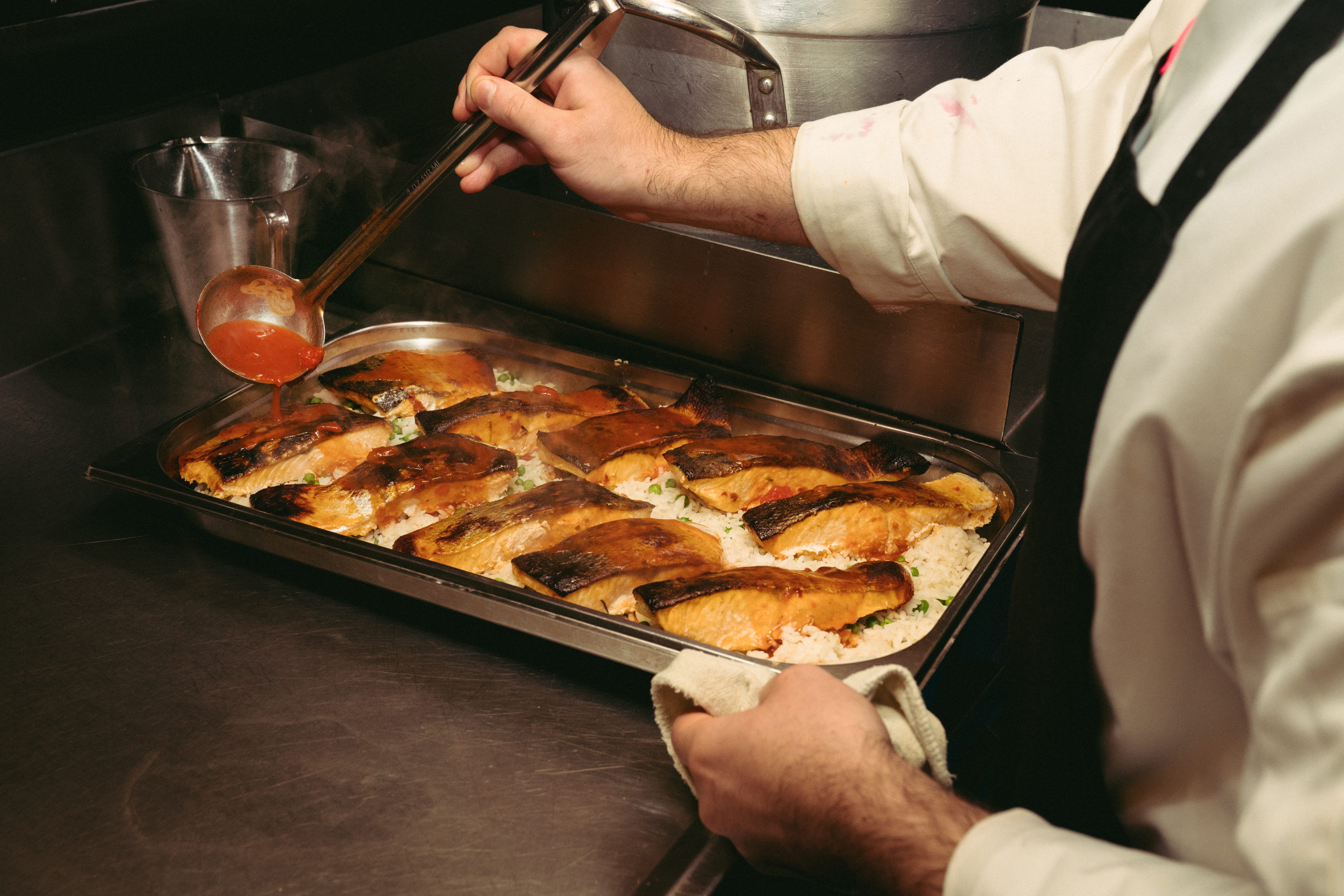Chefs preparing for lunch service at the ship's kitchen ( The Galley).