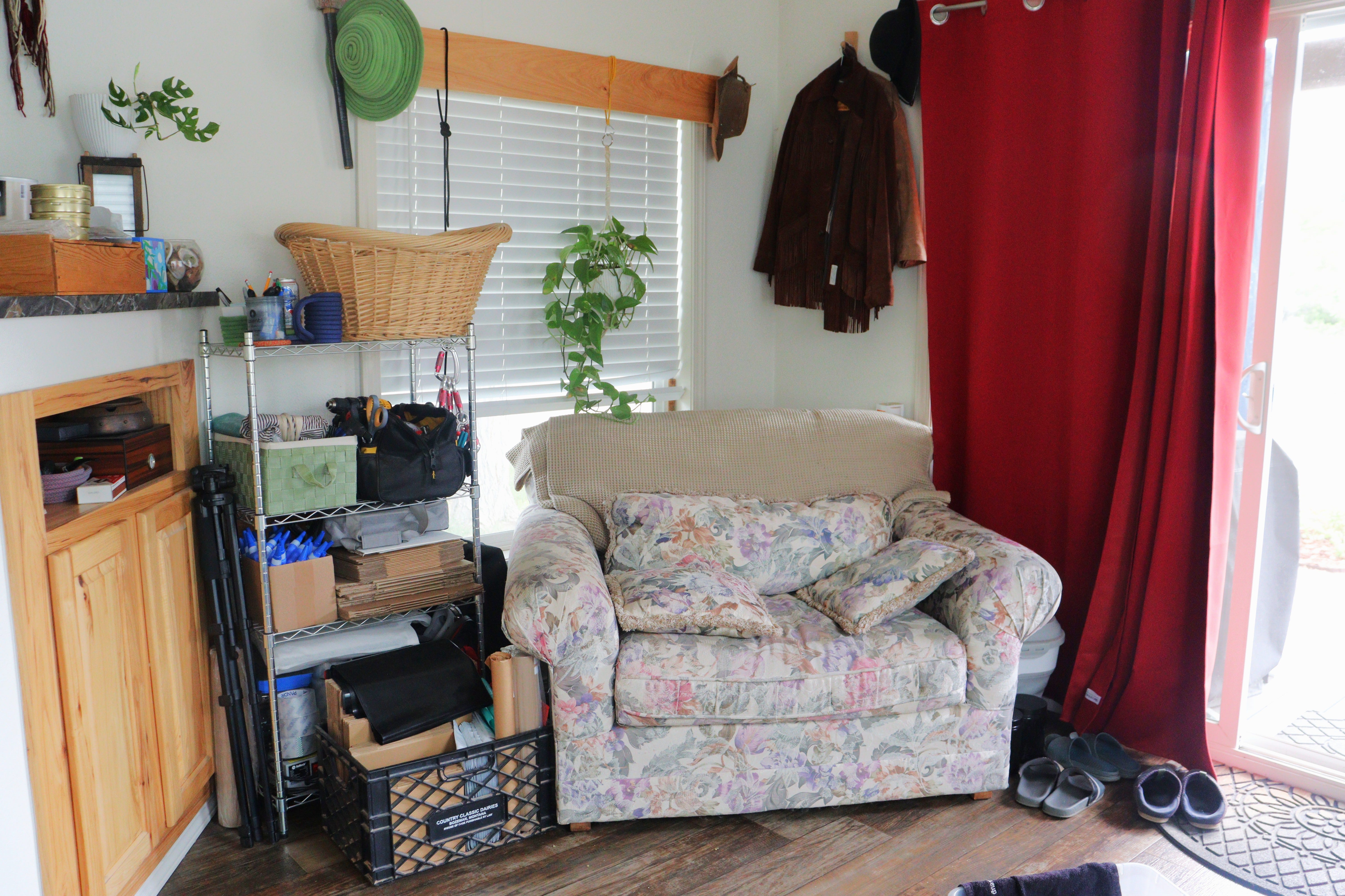 Shelving unit next to chair in tiny home