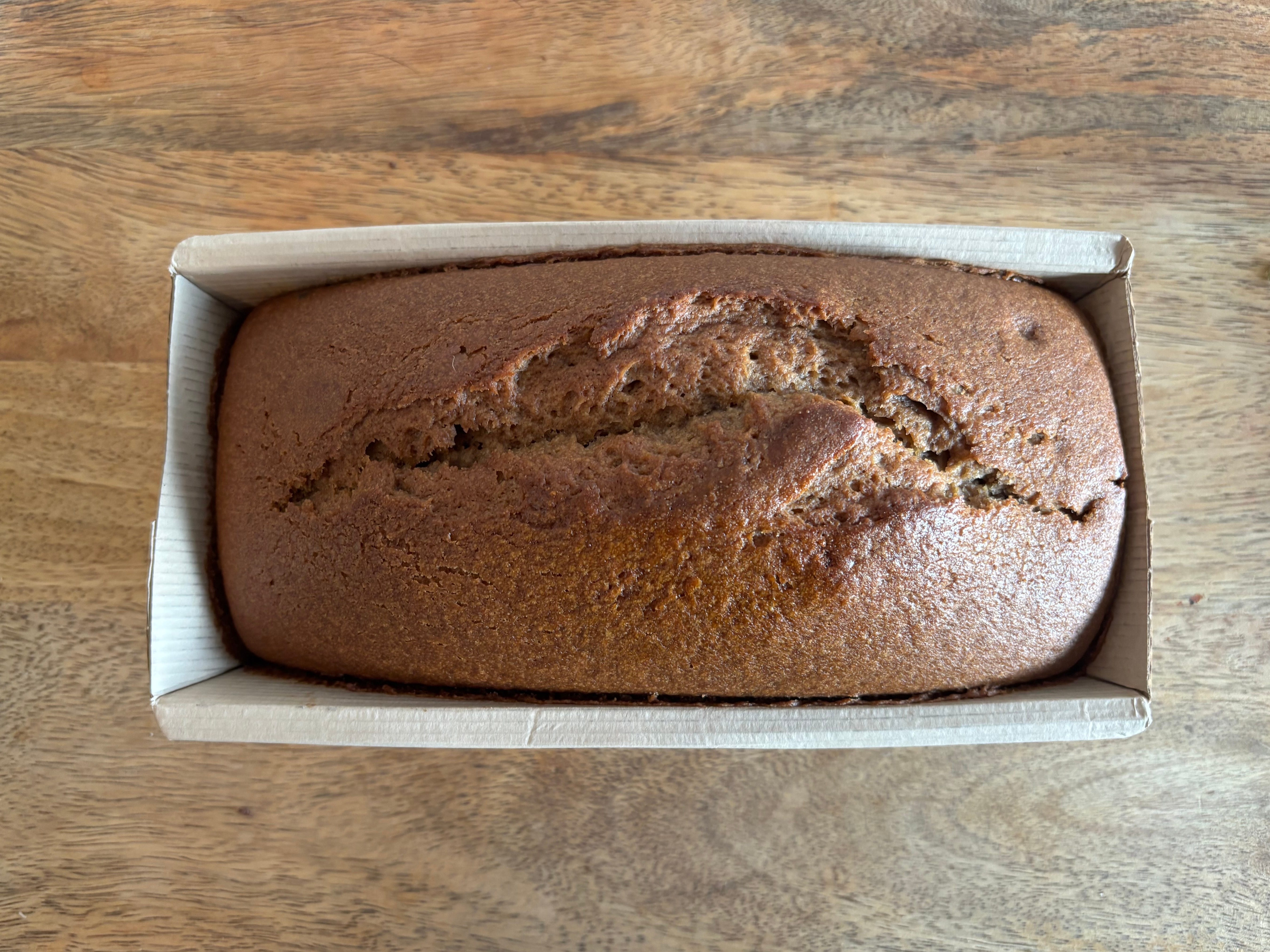 Banana bread in a paper container.