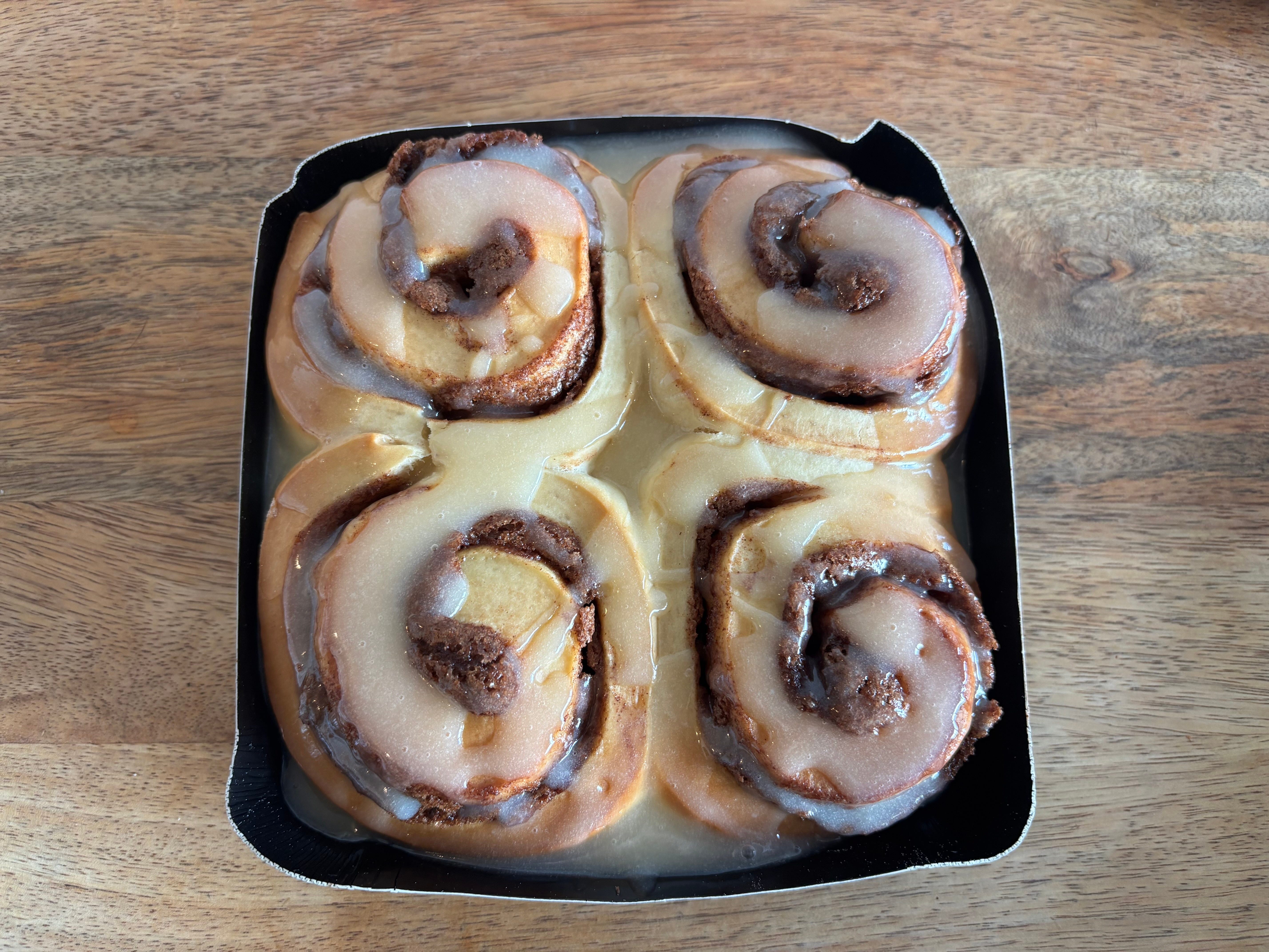 Four cinnamon rolls in a bakeable tray.