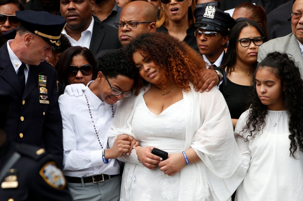 Family members of slain New York City Police Department (NYPD) officer Miosotis Familia react outside the World Changers Church following her funeral service in the Bronx borough of New York City, U.S., July 11, 2017.