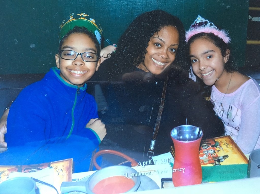 Det. Miosotis Familia (center) with twins Peter (left) and Delilah. 
