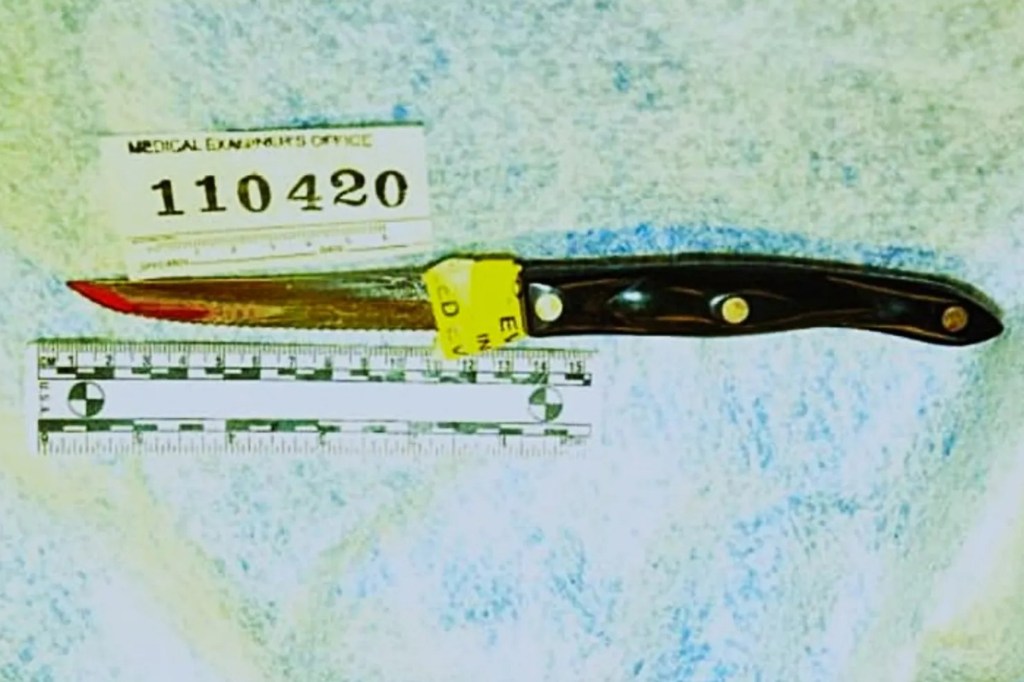 A blood-stained knife with a dark handle, a yellow evidence tag, and a medical examiner's office tag reading 