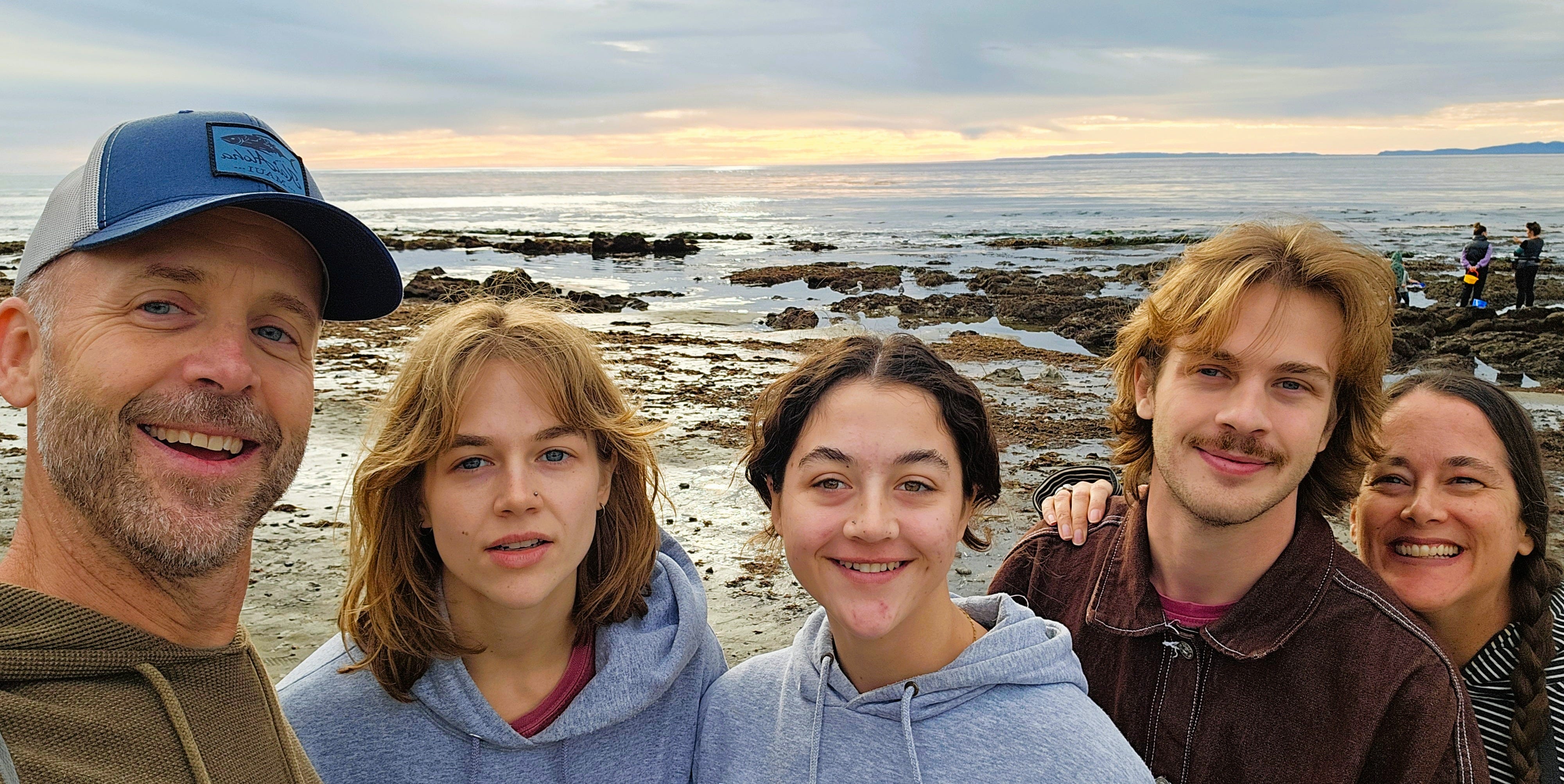 The author (far right) poses with her family on the beach.