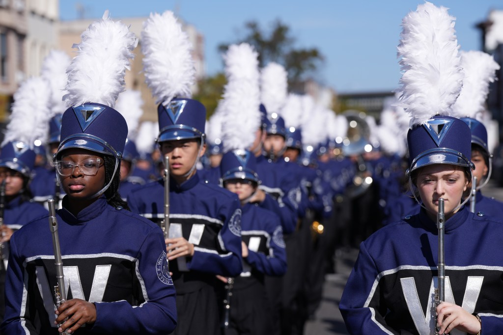 Participants marching in uniform at the Federation of Italian American Organizations 42nd Annual Columbus Day Parade.