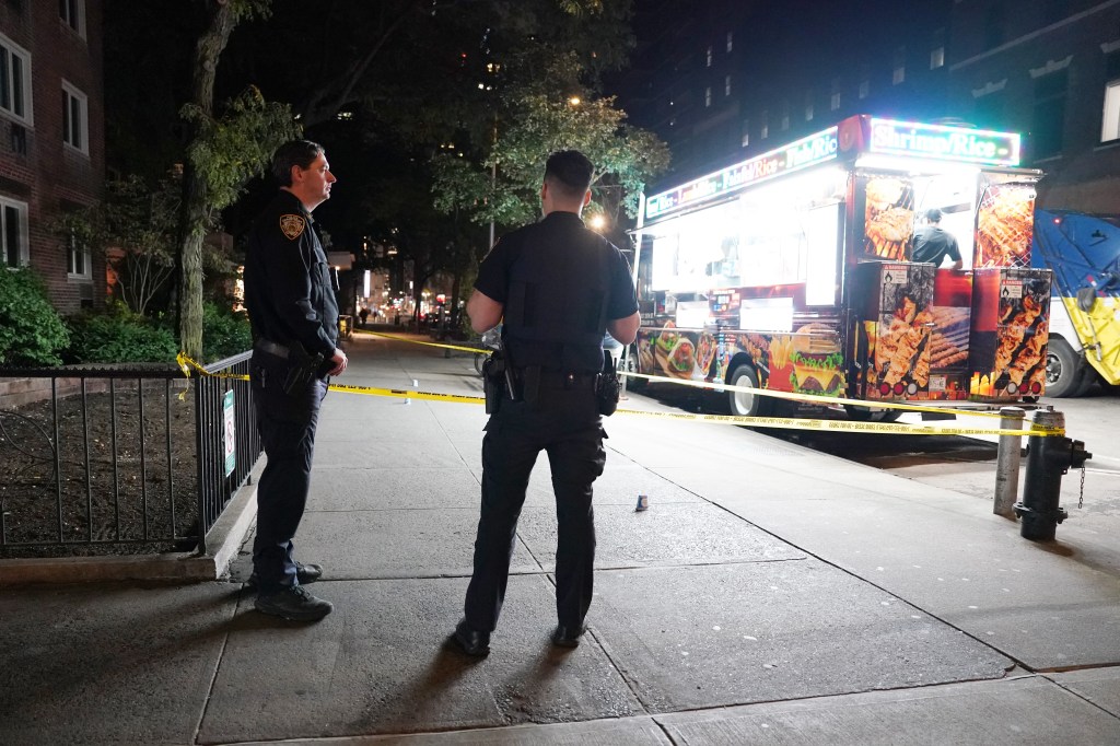 The violent mugger, seen wearing all black, grabbed the 35-year-old woman’s phone at West 58th Street and Ninth Avenue in Hell’s Kitchen around 12:50 a.m. Saturday, police said. 