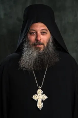 Brian Andrew Bushell, a Marblehead monk and leader of the Shrine of St. Nicholas, wears a dark habit and a large decorative cross.