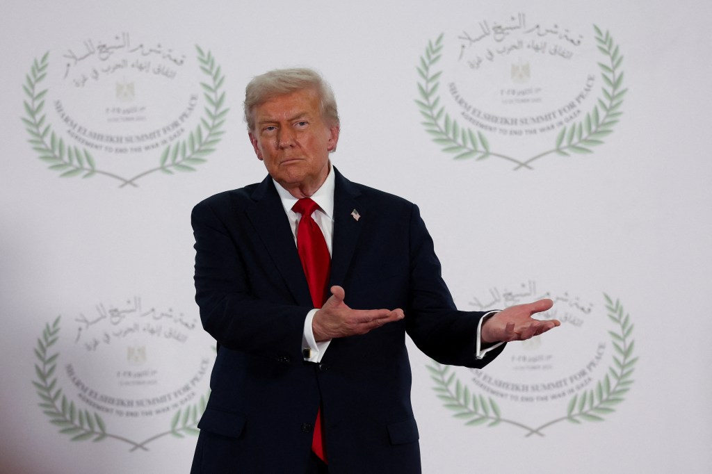 President Donald Trump waits to greet leaders during a summit to support ending the more than two-year Israel-Hamas war in Gaza after a breakthrough ceasefire deal, Monday, Oct. 13, 2025, in Sharm El Sheikh, Egypt.